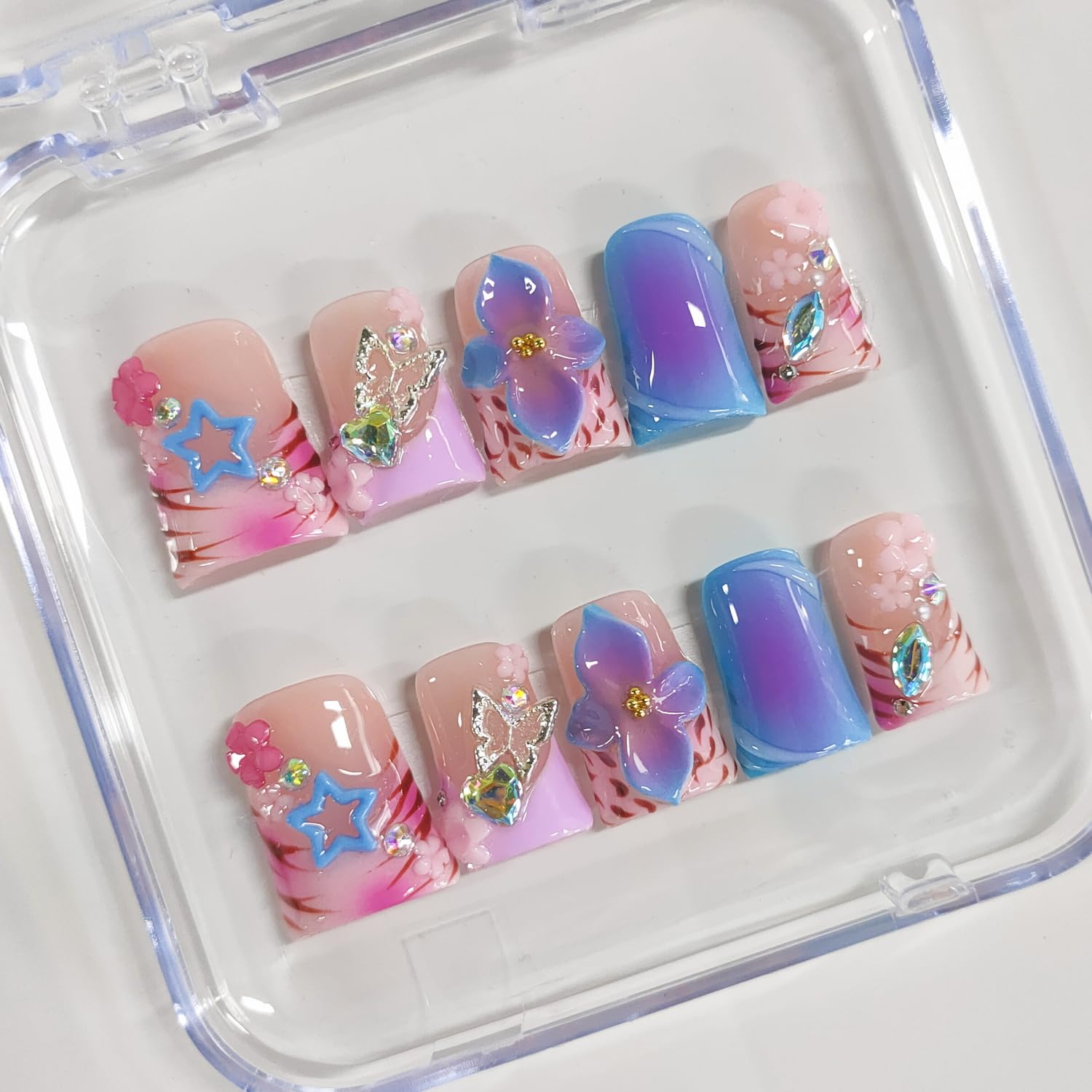BRKYKGK 3D floral nail art on thick acrylic tips for long-lasting wear.