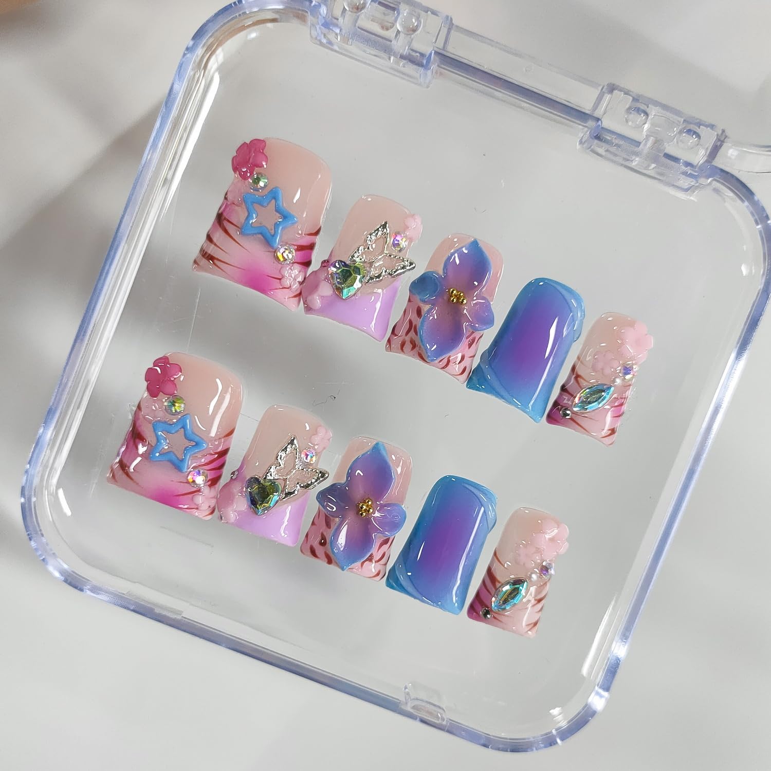 BRKYKGK butterfly and star nail art for whimsical evening looks.