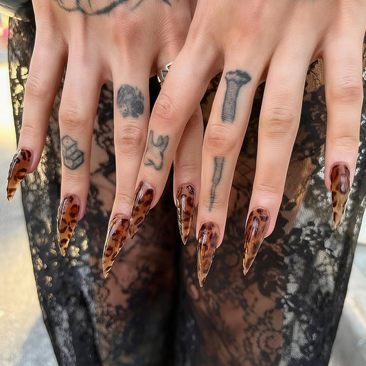 BRKYKGK eagle claw design nails in brown add bold statement to evening looks.