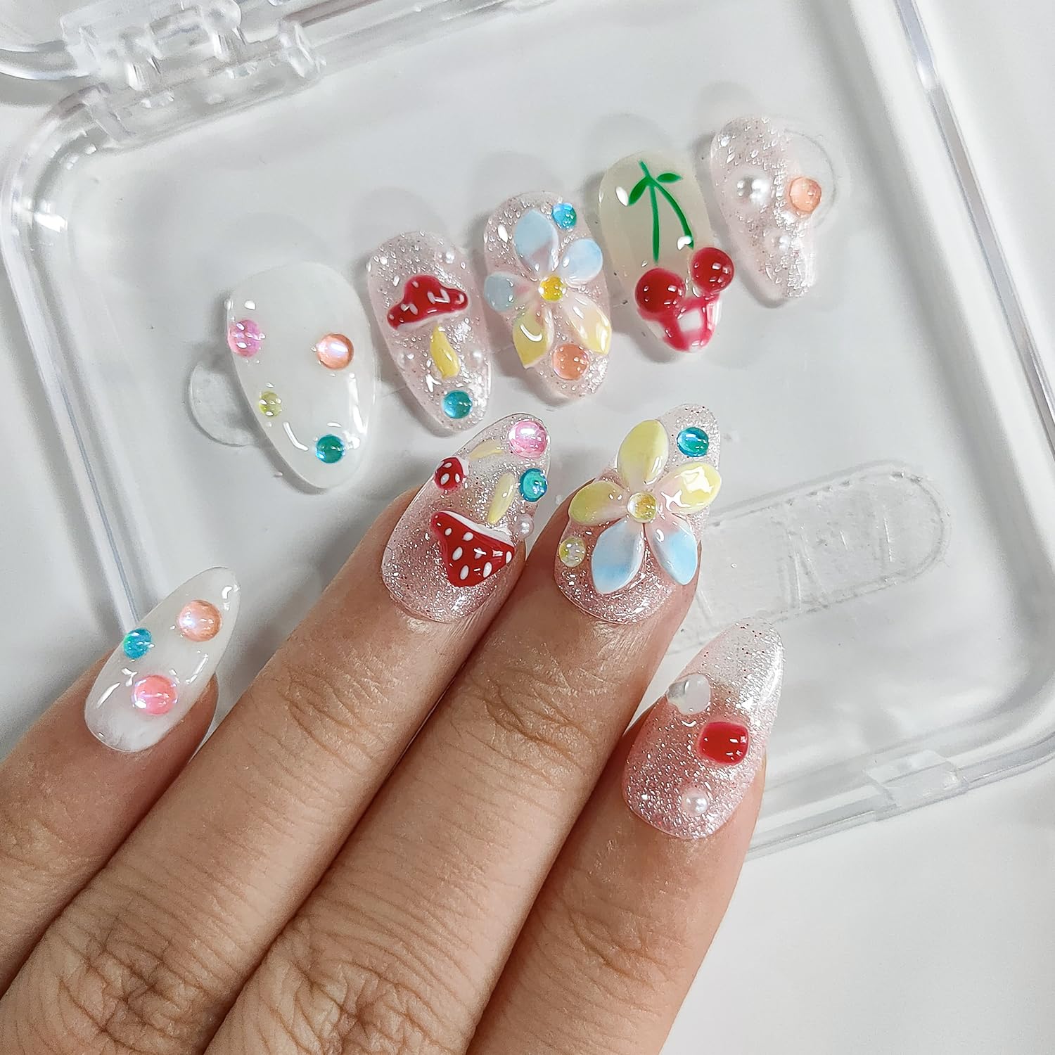 BRKYKGK nails feature glitter cherry design adding playful sparkle to any look