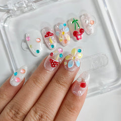 BRKYKGK nails feature glitter cherry design adding playful sparkle to any look