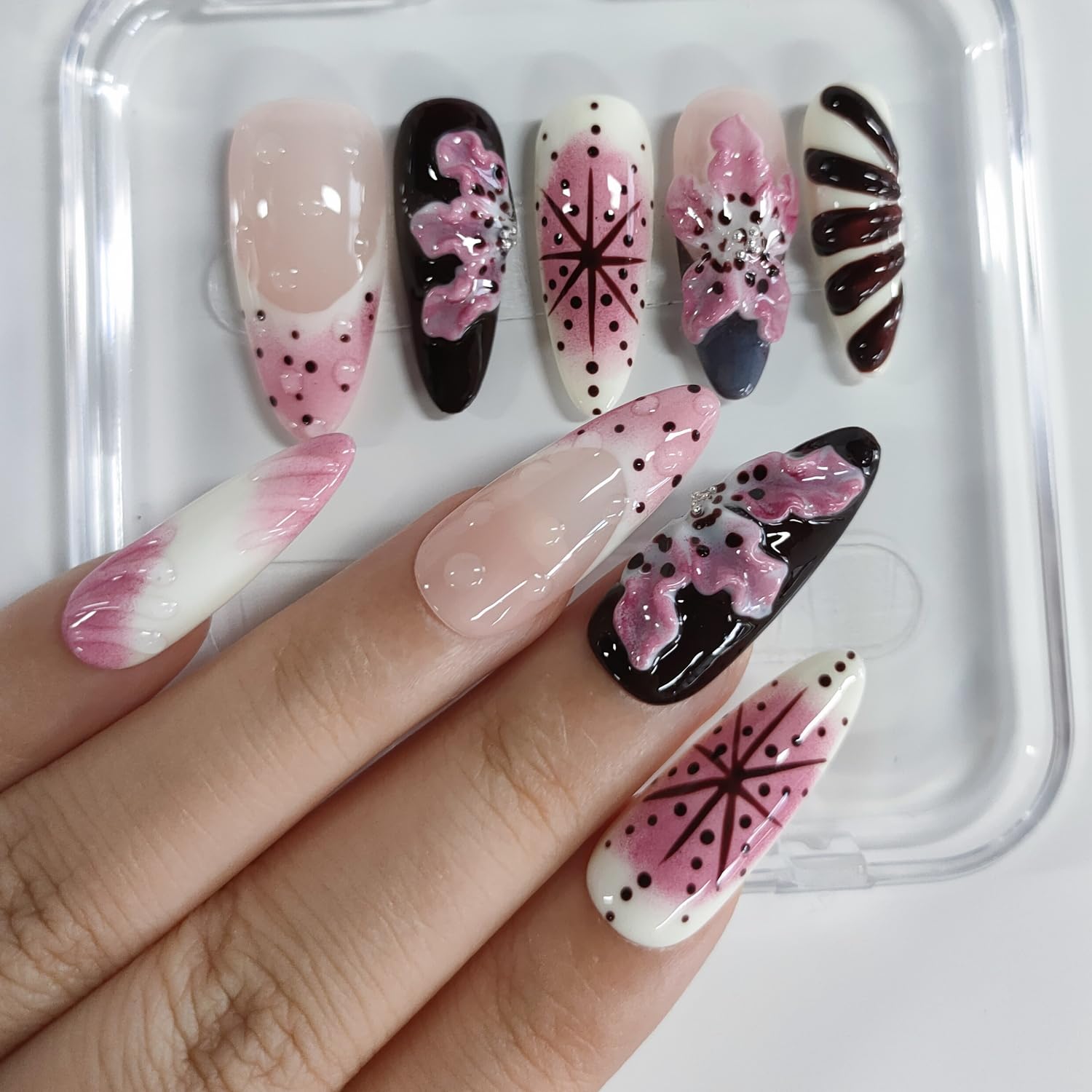 BRKYKGK almond nails with rose floral accents for romantic manicure