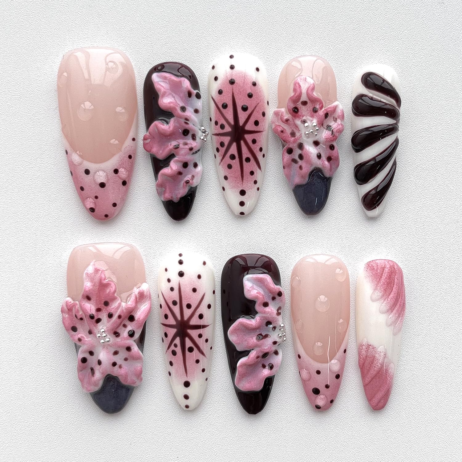 BRKYKGK almond medium nails featuring water drop detail for flair