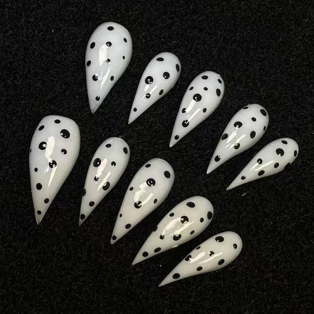 BRKYKGK medium stiletto eagle claw nails with black and white polka dots for quick glam