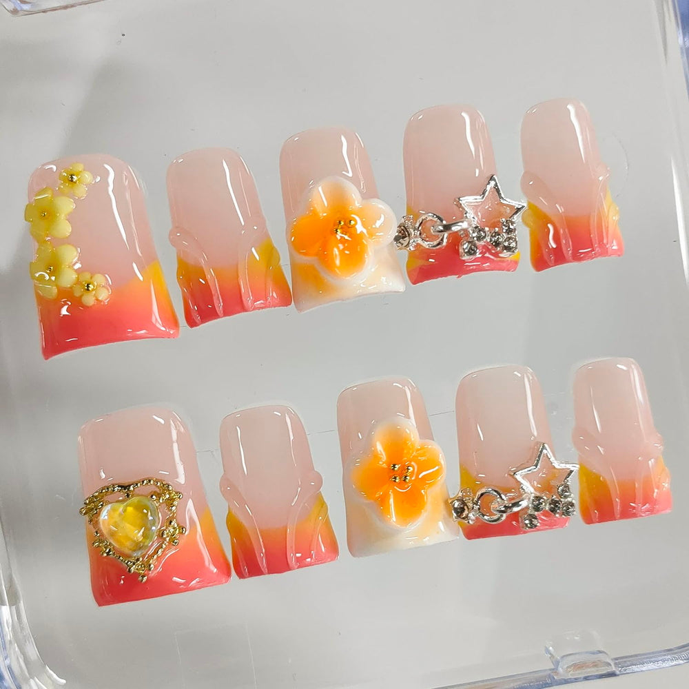 BRKYKGK orange false nails with flower stars and heart designs