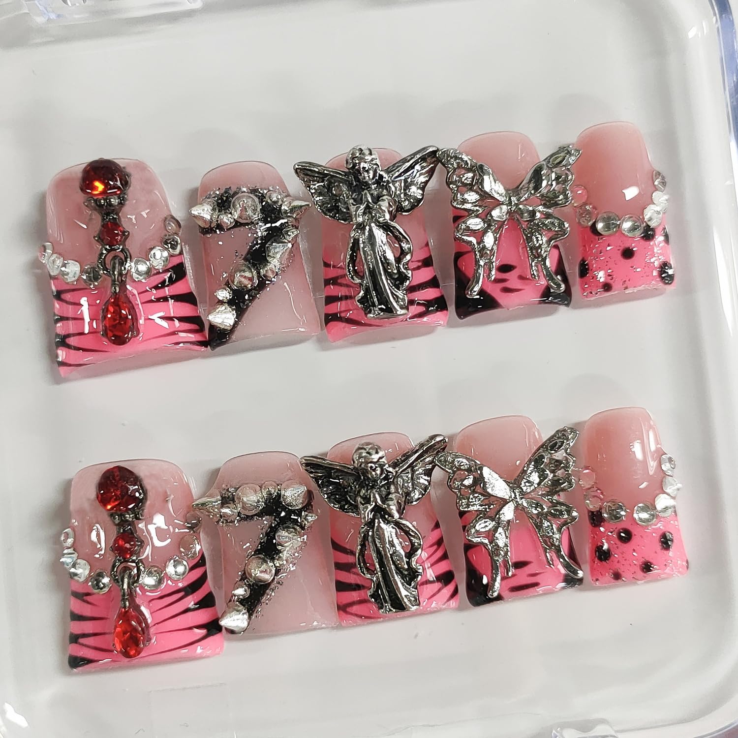 BRKYKGK pink French tip nails with spikes for edgy everyday glam.