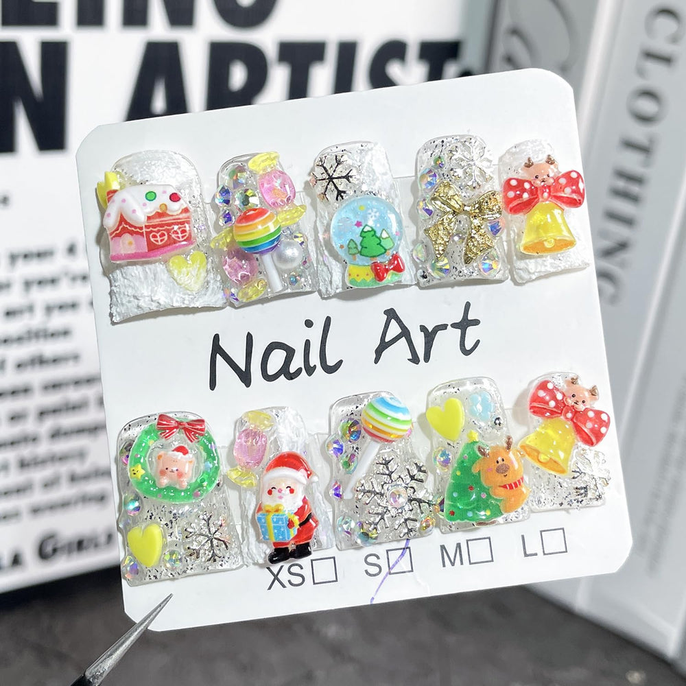 BRKYKGK nails with bow Santa charms for festive sparkle at events