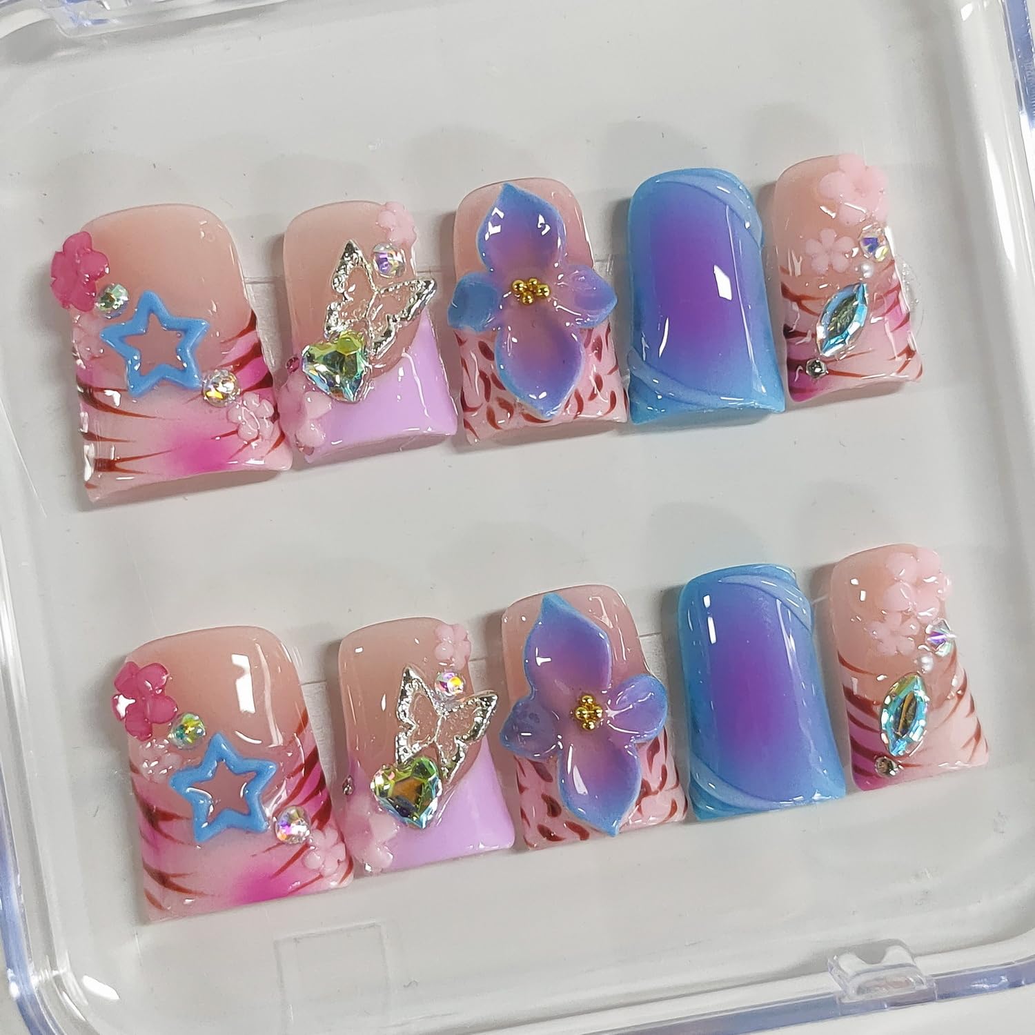BRKYKGK short duck nails with 3D flower accents for a playful look.