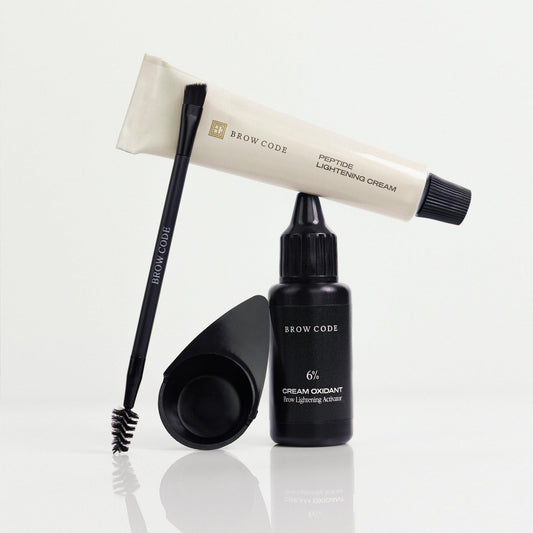 Brow Code 6% oxidant bottle provides controlled brow lightening.