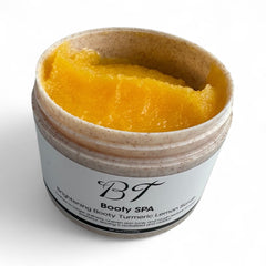 BT Booty Spa Scrub label detailing lemon-turmeric blend for uneven tone targeting.