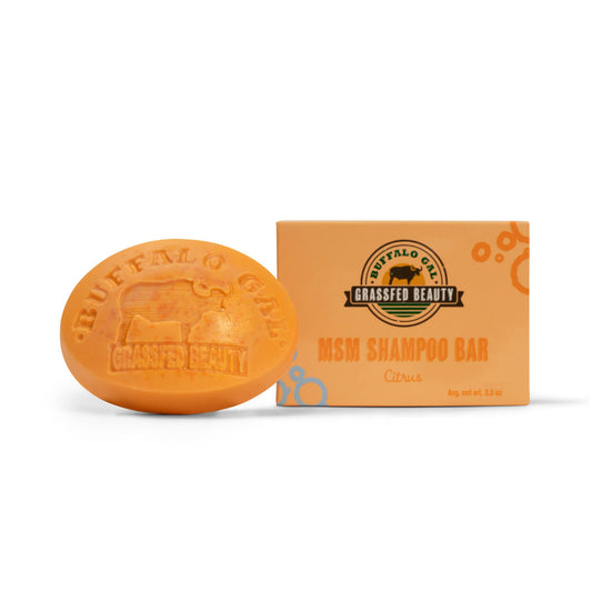 BUFFALO GAL MSM + Tallow Shampoo Bar in hand, portable cleansing for travel.