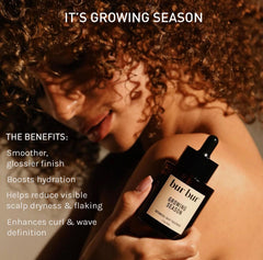 Applying BUR BUR Growing Season oil to the scalp for nourishment