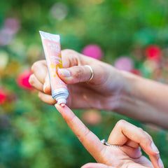 Burt's Bees squeeze-tube cap shown for travel-friendly lip color