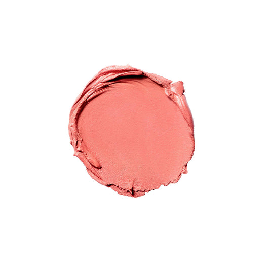 Close-up of creamy coral sheer texture swirled for a diffused, buildable glow on skin