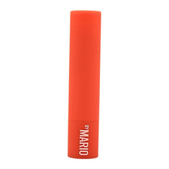 BY MARIO MoistureGlow Lip Serum on lips delivers hydrating color with dewy shine