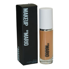 BY MARIO SurrealSkin foundation bottle shows vegan long-wear coverage.