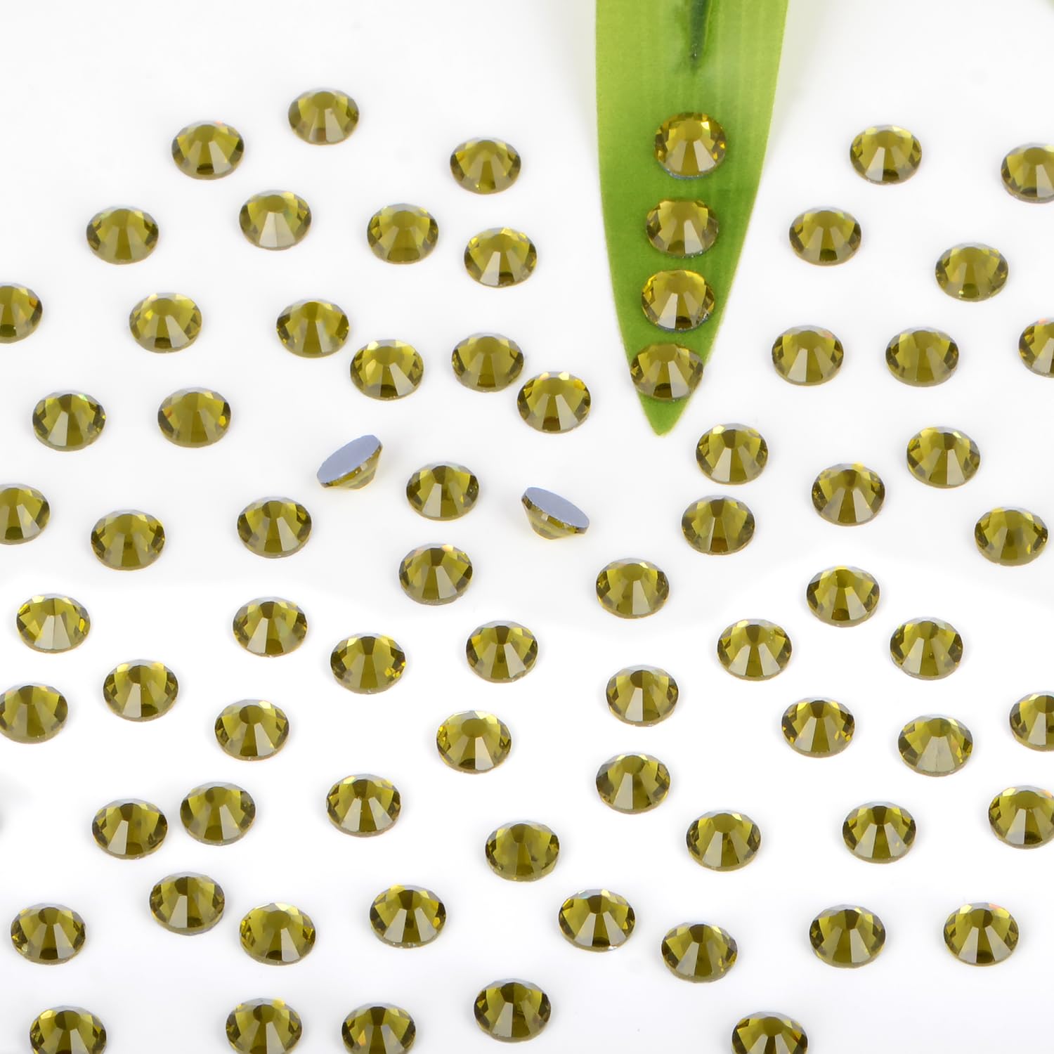 Bymitel Olivine 3.8mm rhinestones with heat-activated glue for easy application.