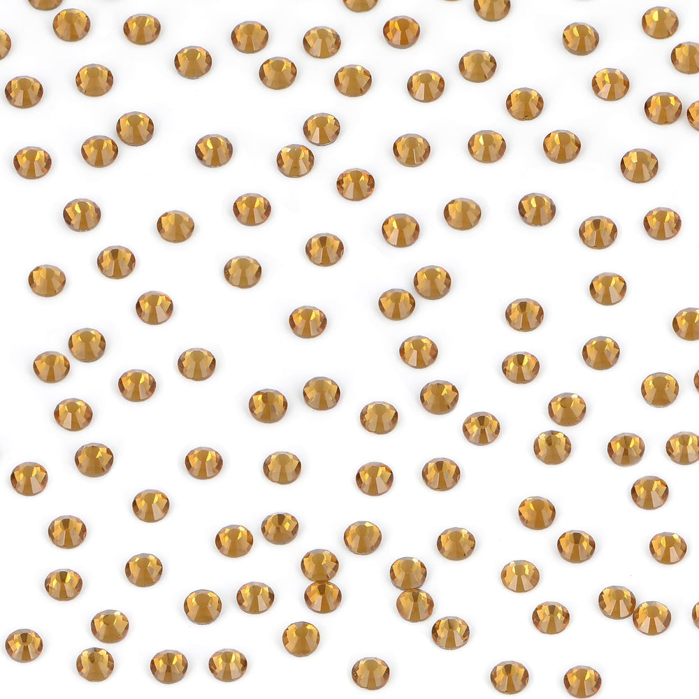 Bymitel Lt. Topaz rhinestones decorate phones, shoes, and bags with sparkle