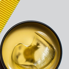 BYRD Slick Pomade 2-pack in-use for smooth hair styling and shine