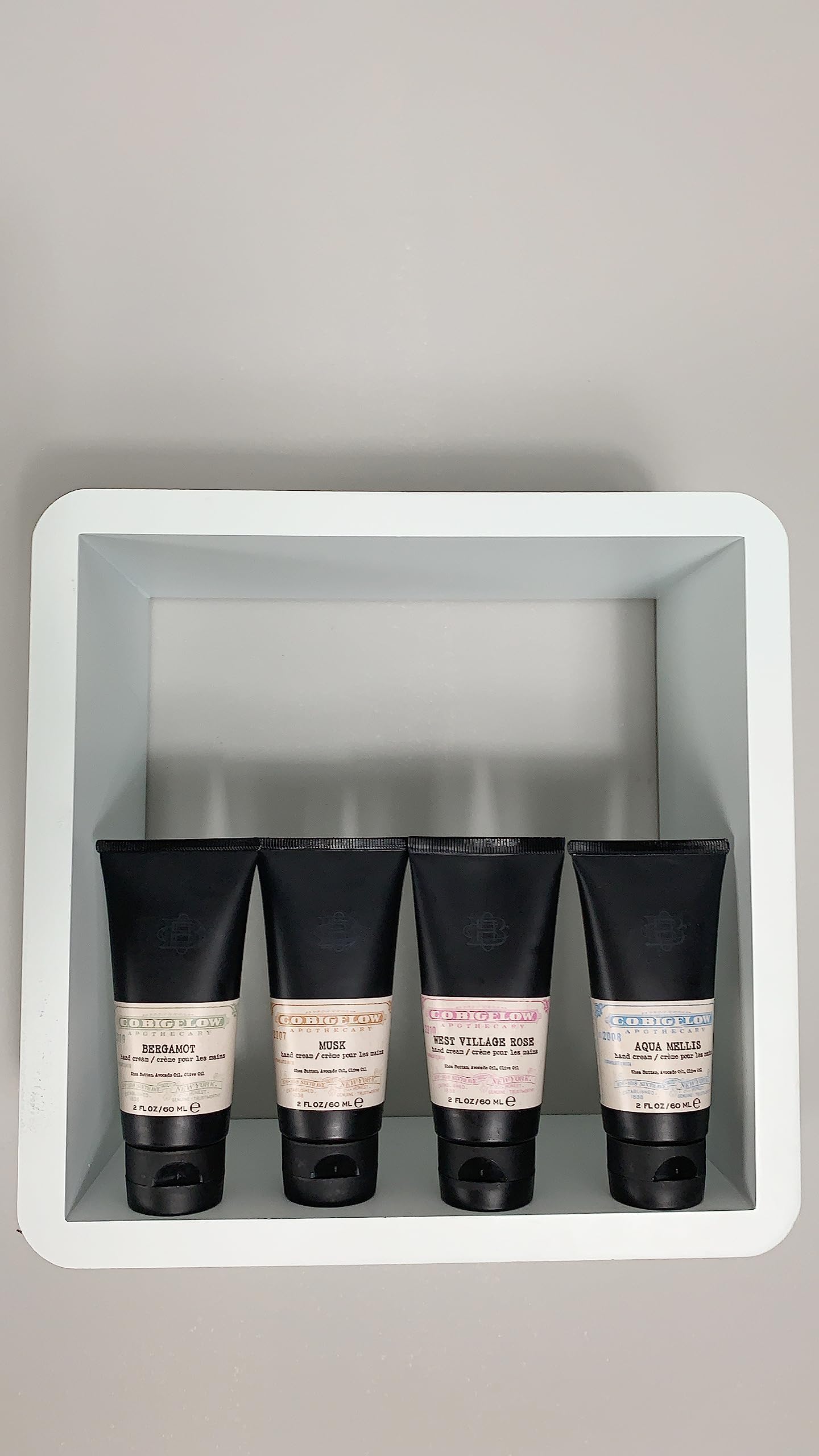Applying C.O. Bigelow Vetiver hand cream for quick absorption and subtle aroma.