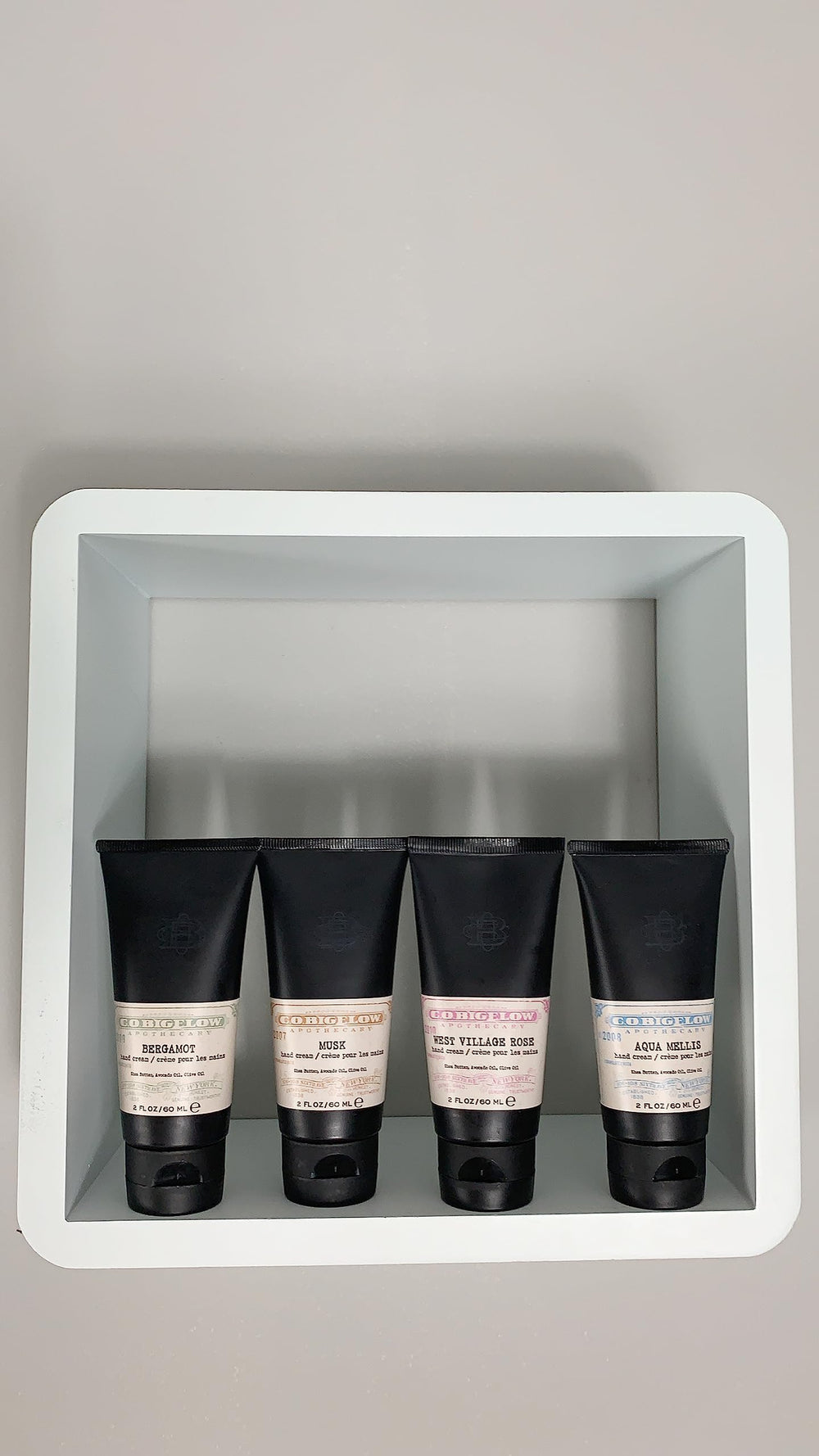 Applying C.O. Bigelow Vetiver hand cream for quick absorption and subtle aroma.