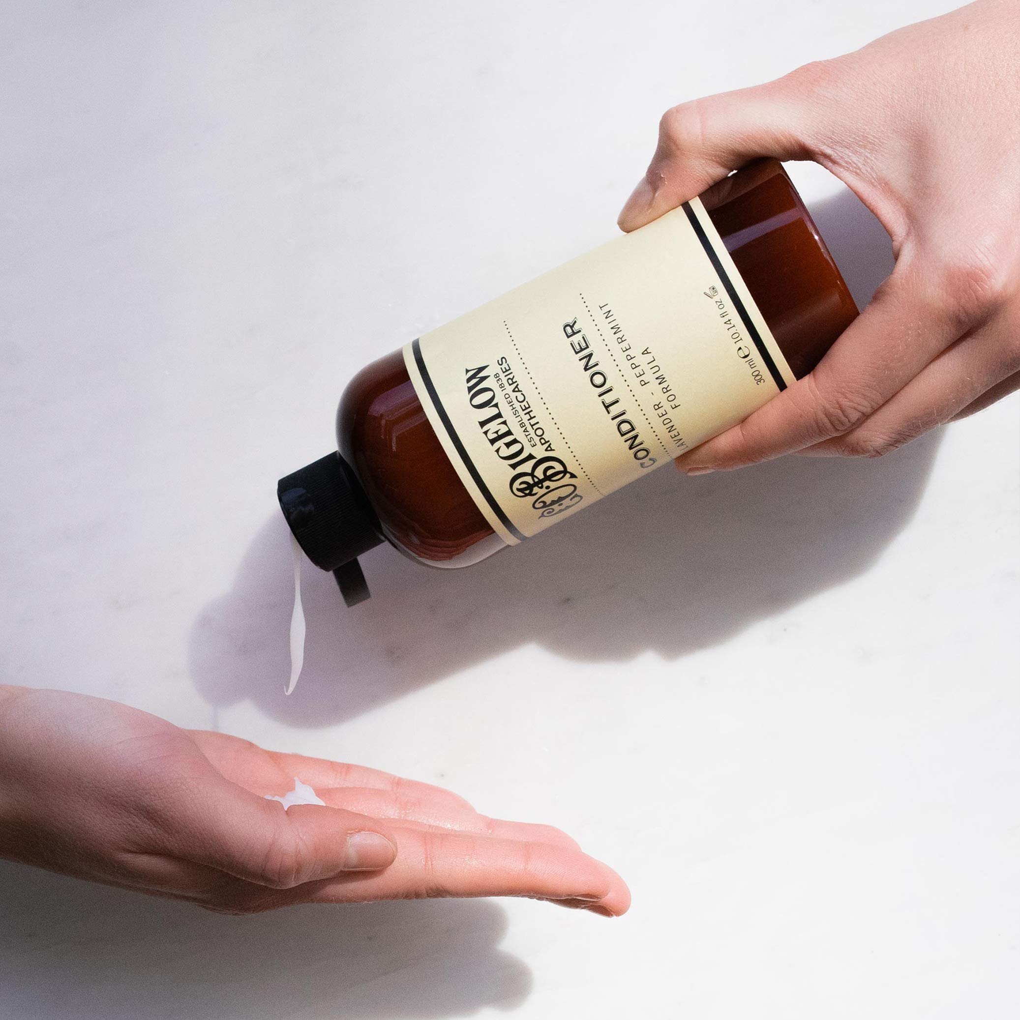 C.O. Bigelow Lavender Peppermint Conditioner hair application close-up shows smooth, hydrated strands