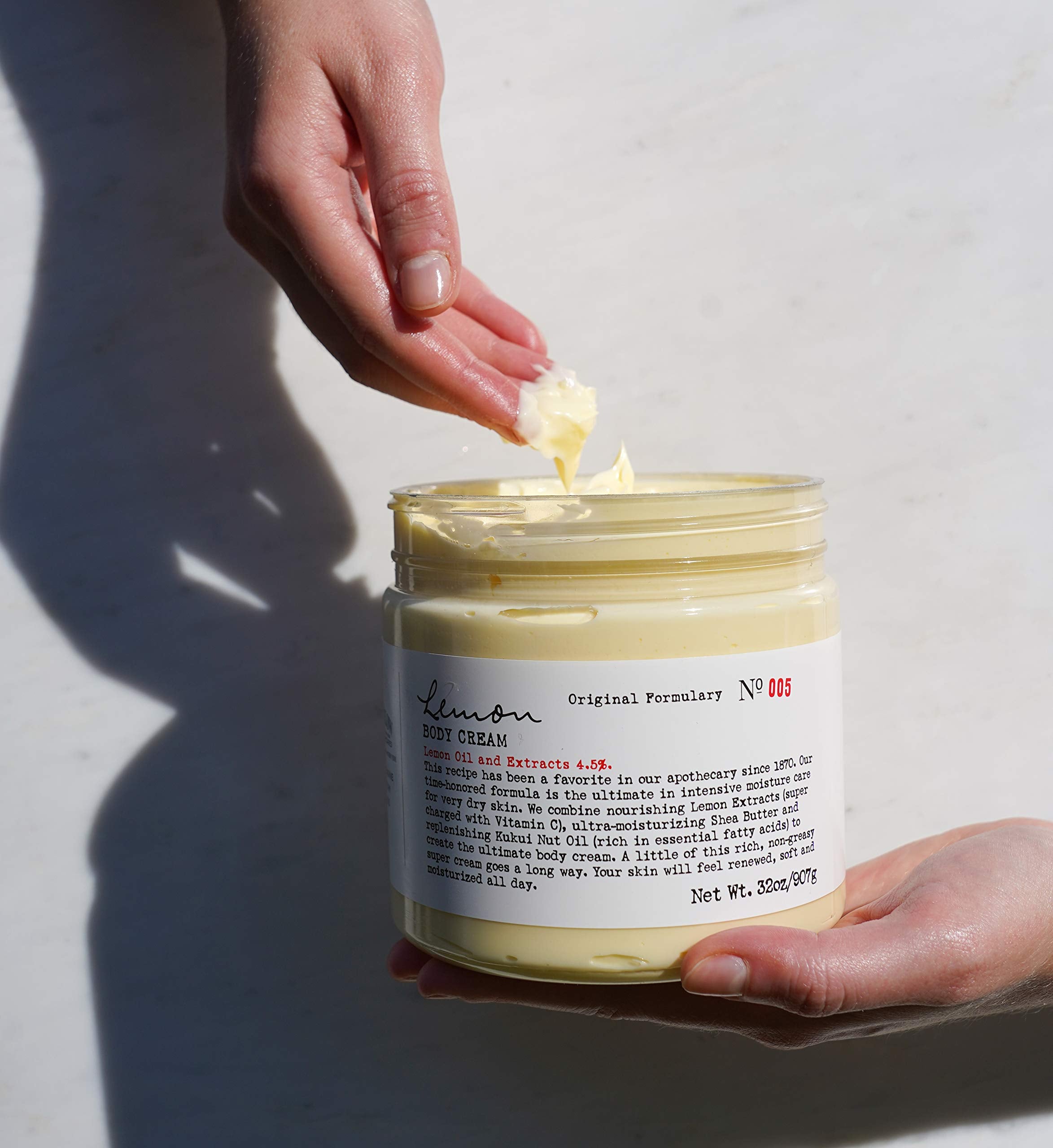C.O. Bigelow Lemon Body Cream displayed in a bathroom setup