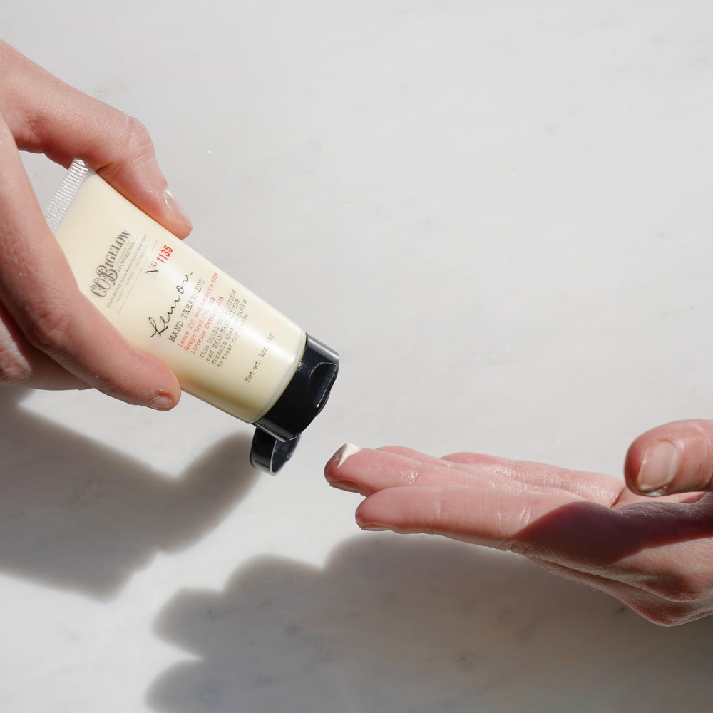 Close-up of C.O. Bigelow Lemon Hand Treatment applying on skin