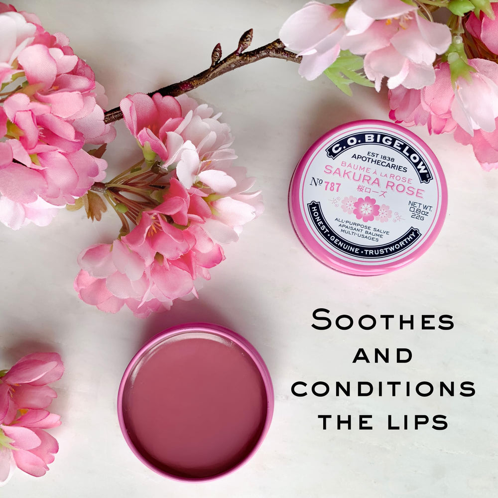 Applying C.O. Bigelow Sakura Rose Salve on lips for softness