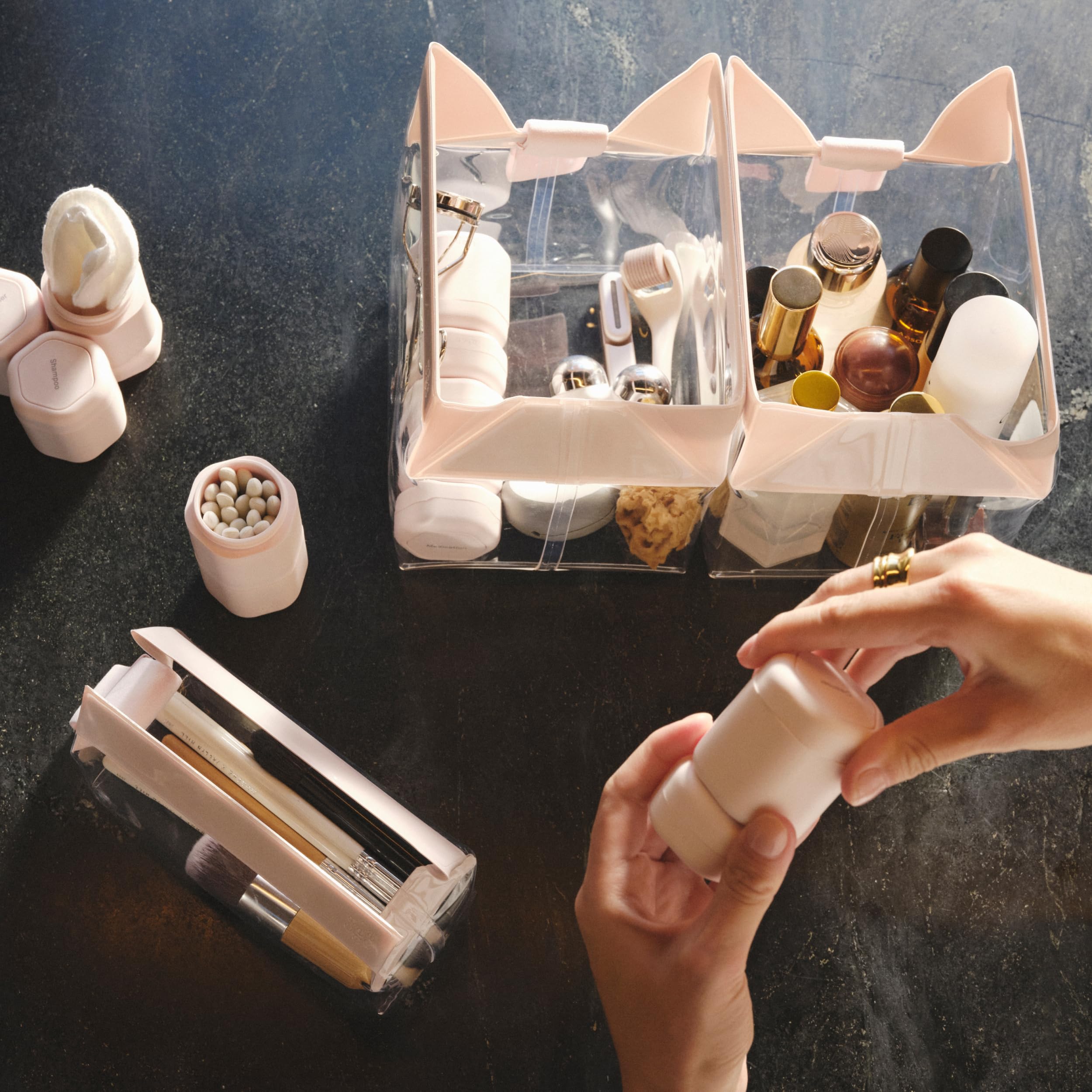 Cadence compact capsules hold shampoo, conditioner, and pills neatly.