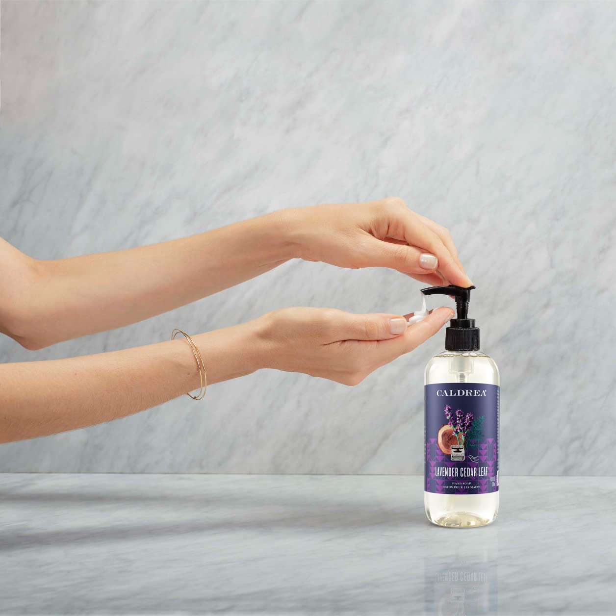 Caldrea Lavender Cedar Leaf close-up highlights calming scent notes.