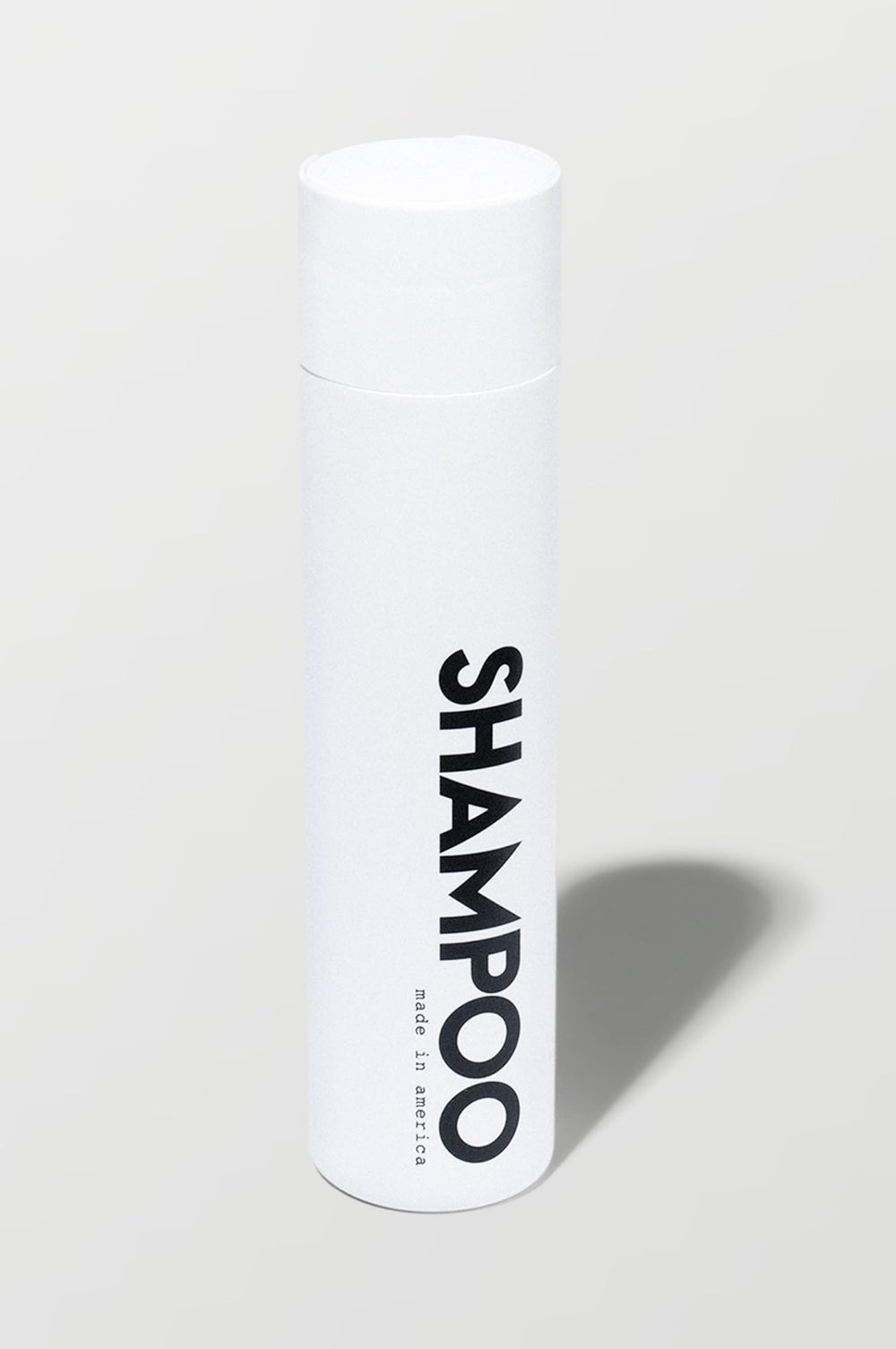 California Born sulfate-free shampoo bottle close-up with beachy coconut scent for all hair types