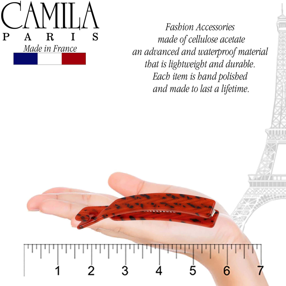 Hands holding Camila Paris CP2510 banana clip to demonstrate gentle, comfortable hold