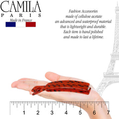 Hands holding Camila Paris CP2510 banana clip to demonstrate gentle, comfortable hold