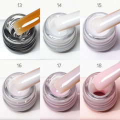CANNI Milky white builder gel bottle for soft, natural-looking nail extensions.