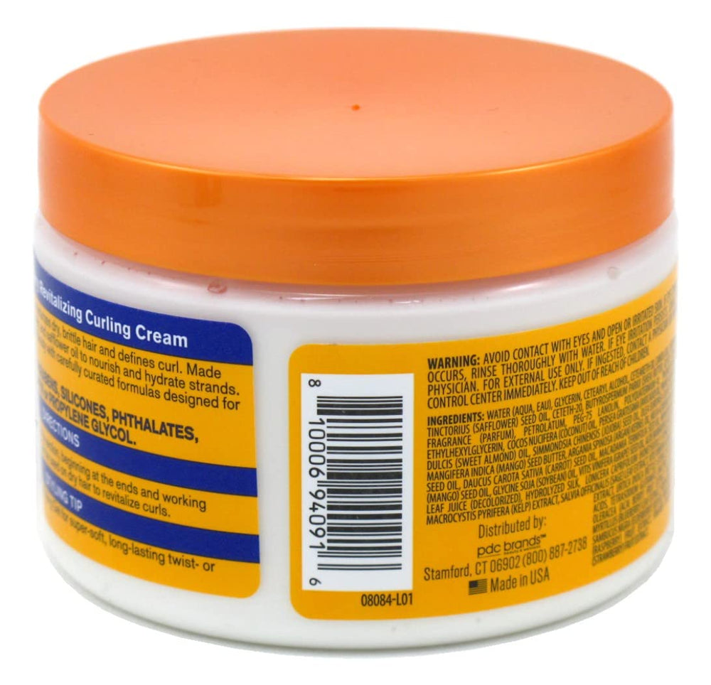Cantu Acai Berry Curling Cream application smooths curls for definition.