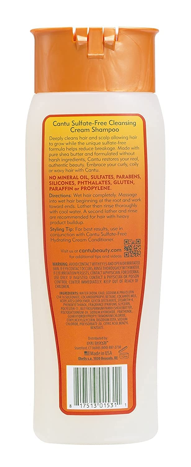 Cantu shampoo lather demonstrates gentle cleansing and buildup removal on textured hair.