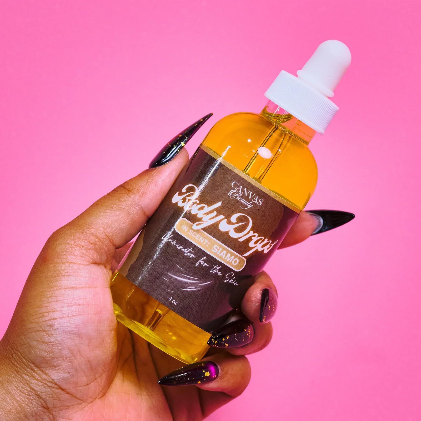 Canvas Beauty Body Drops Siamo coconut jojoba vitamin-e blend nourishes skin.