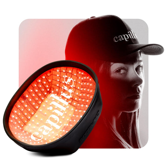 Capillus PRO front view, discreet red light cap for at-home hair support.