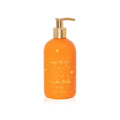 Capri Blue Pumpkin Dulce bottle with pump on counter, showcasing luxe design.