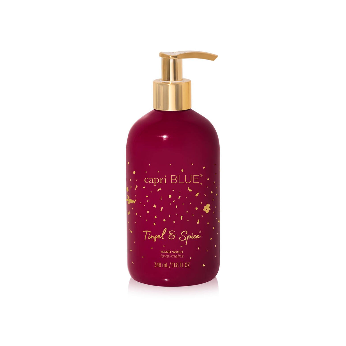 Capri Blue Tinsel & Spice bottle with luxe detailing enhances bathroom decor.