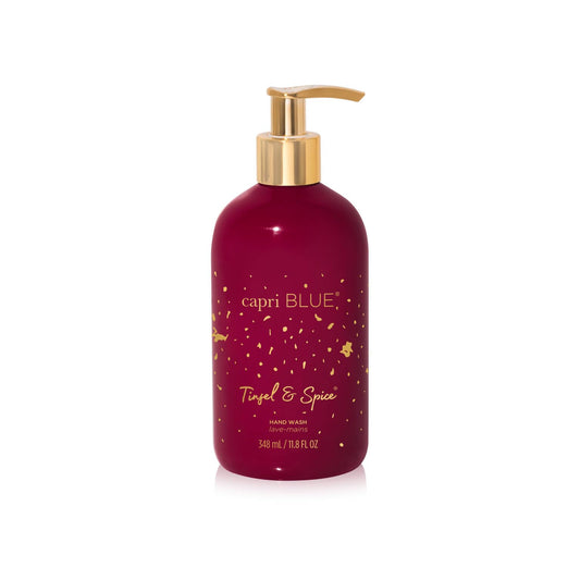 Capri Blue Tinsel & Spice bottle with luxe detailing enhances bathroom decor.