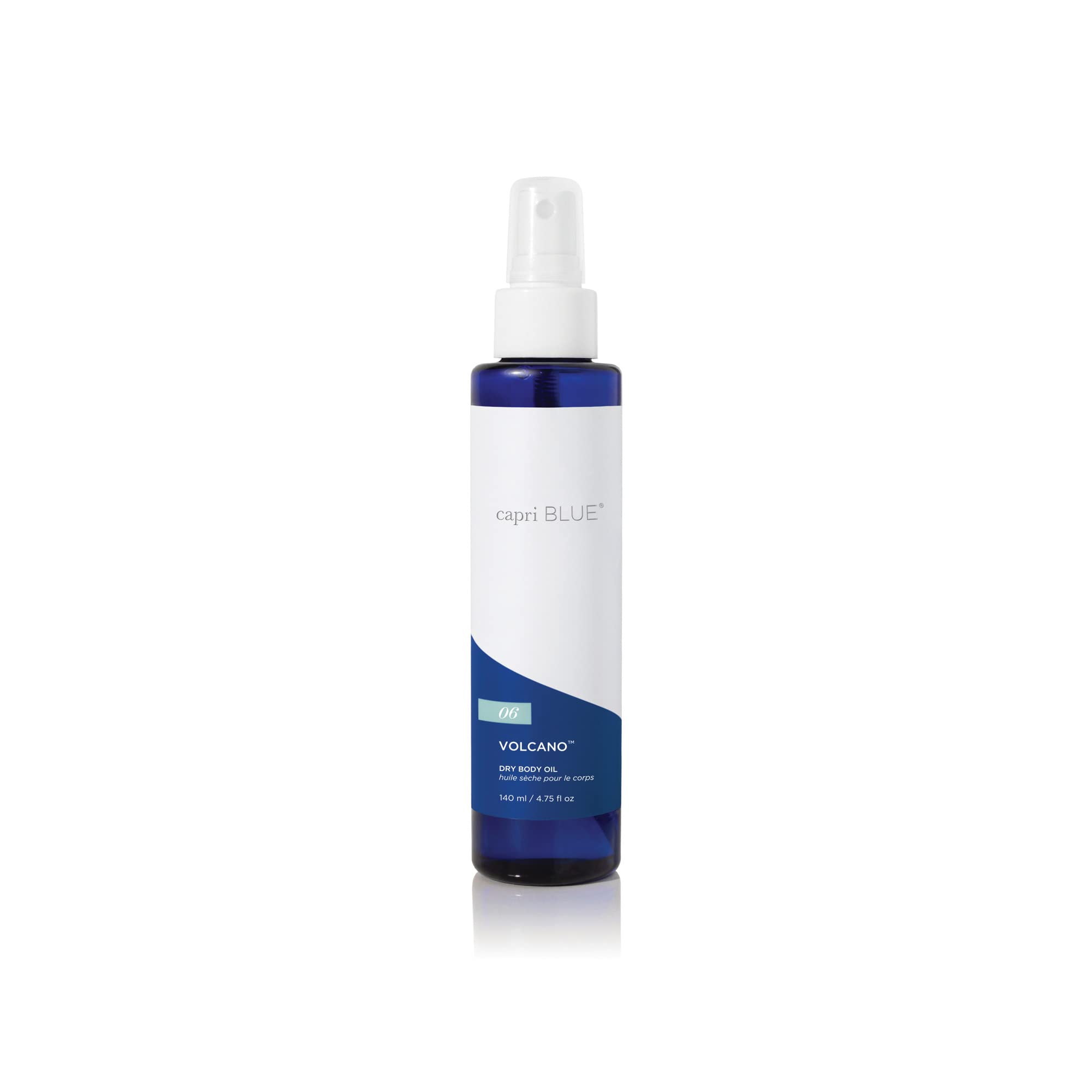 Capri Blue Volcano dry oil spray bottle pouring for quick, non-greasy hydration.