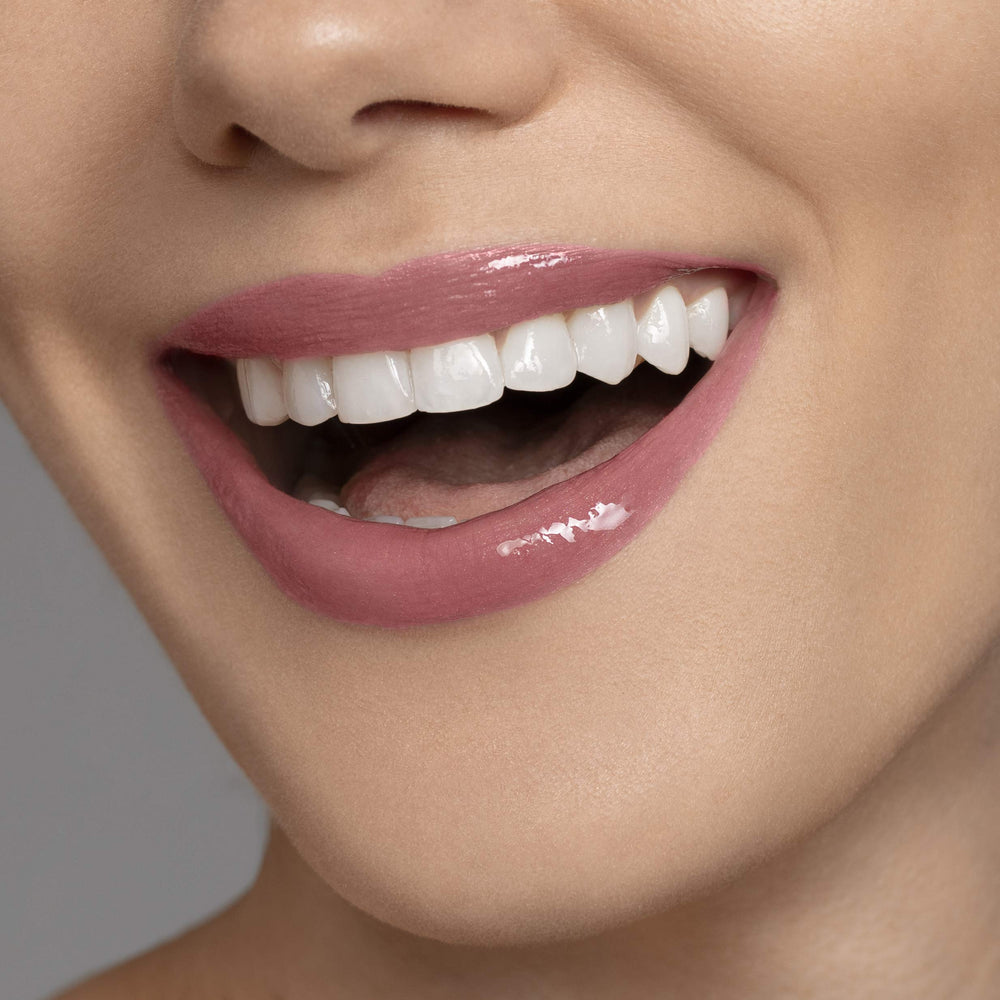 Careline Everlast lip color 705 nude brown worn on lips for smooth color and moisture.