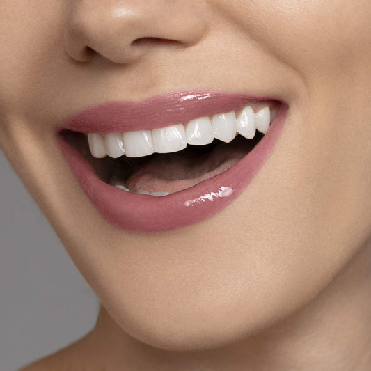 Careline Everlast lip color 705 nude brown worn on lips for smooth color and moisture.