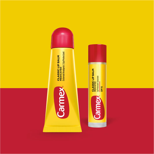 Carmex medicated lip balm sticks with SPF 15 for sun protection.