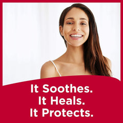Applying Carmex on lips during cold weather for comfort and hydration.
