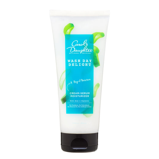 Carol's Daughter Wash Day Delight Cream Serum jar close-up showcases hydrated curls