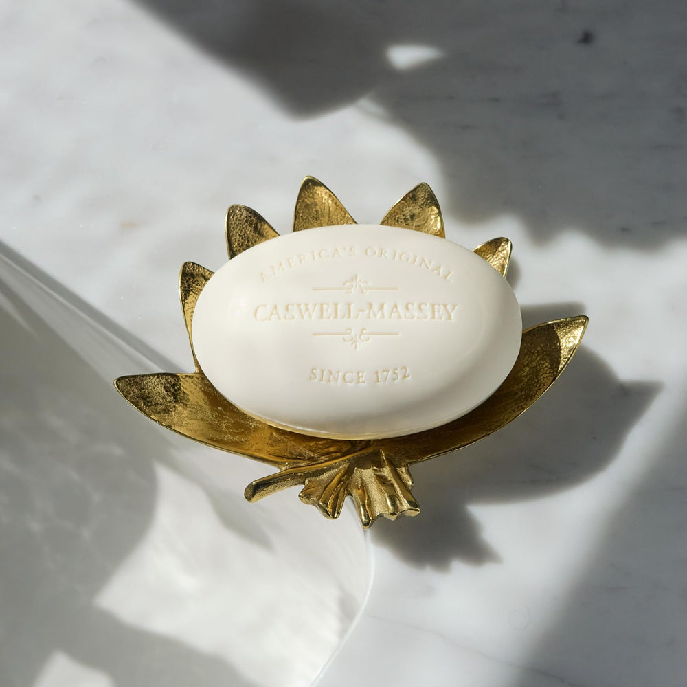Caswell-Massey almond soap bar with plant-based formula close-up.