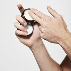 Caswell-Massey Fiber-Style pomade on a comb for a low-shine, natural look.